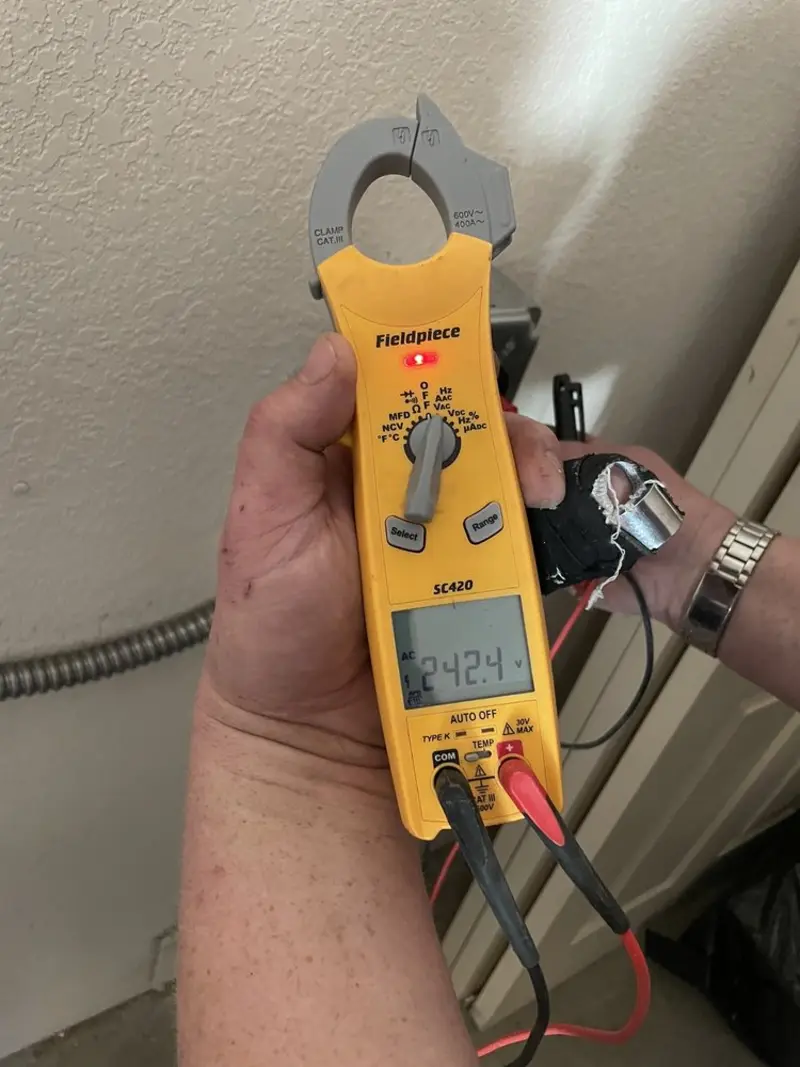 Voltage testing with clamp meter during Recessed Lighting Installation in Hilltown